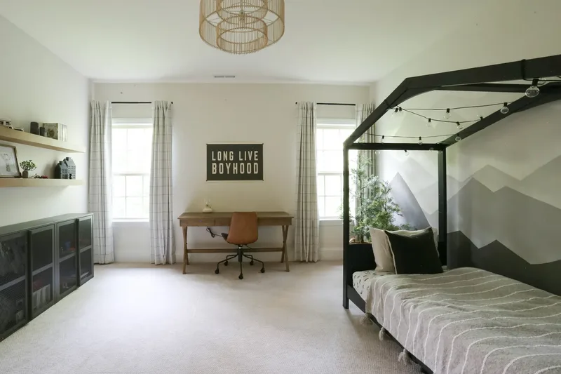 Nearly the same view framed lower, showing the whole pendant and the bed's striped grey blanket