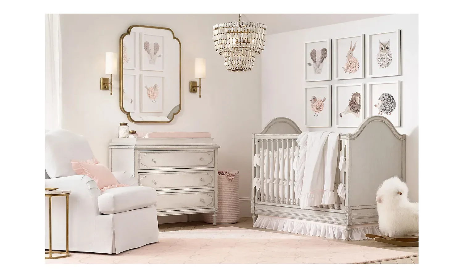Inspiration: a grey arched crib and white nursing chair under a beaded chandelier