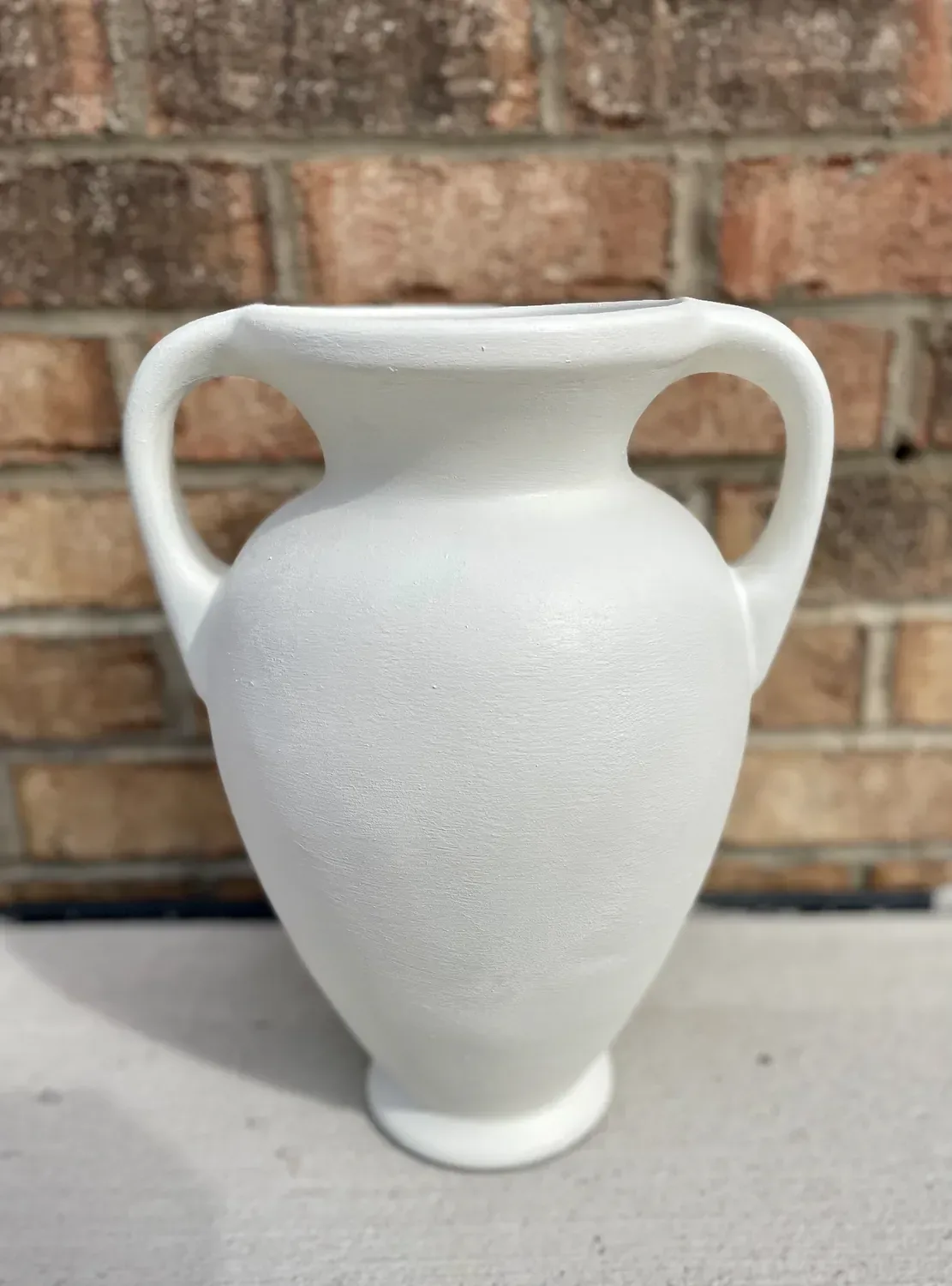 The vase fully dried in plain matte white, before any coffee-ground weathering