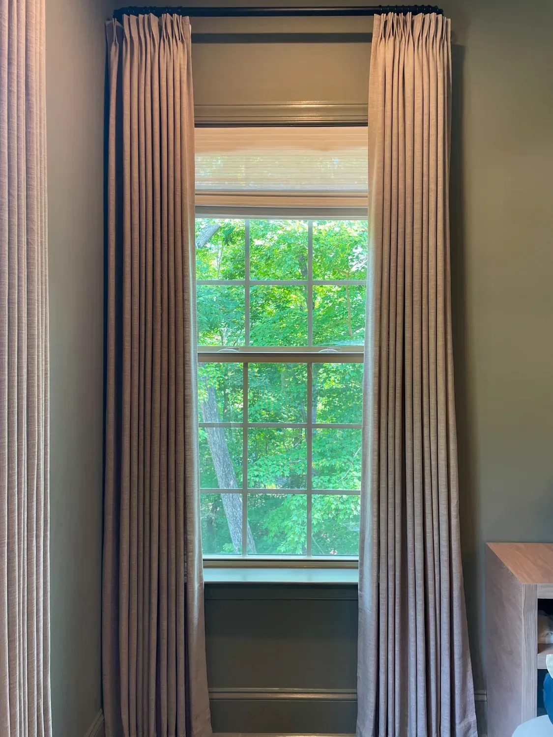 The same panels after steaming, falling in crisp, even pleats