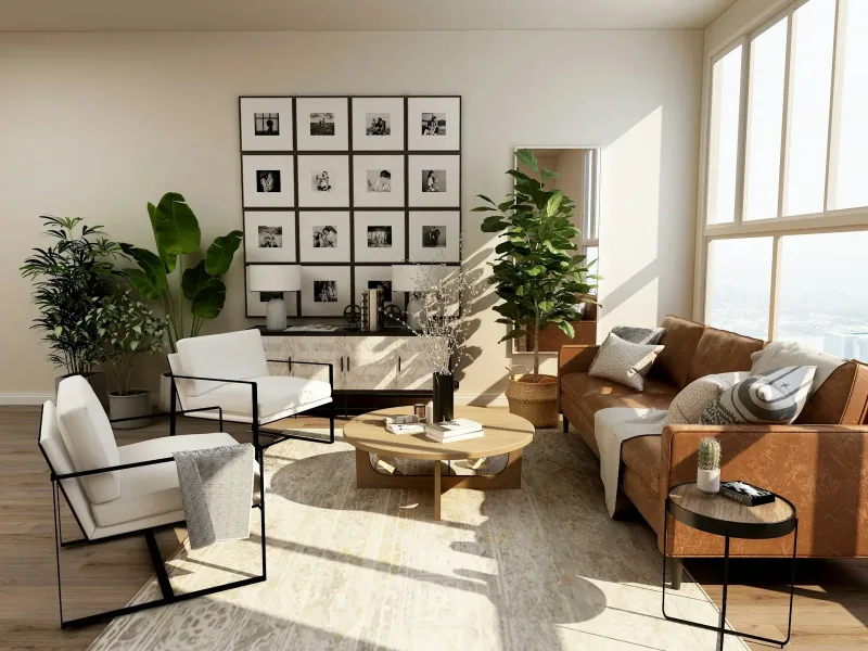 Sunlit living room with a gallery wall, a leather sofa and tall windows