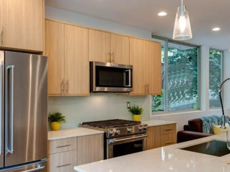 Light kitchen with natural wood cabinetry