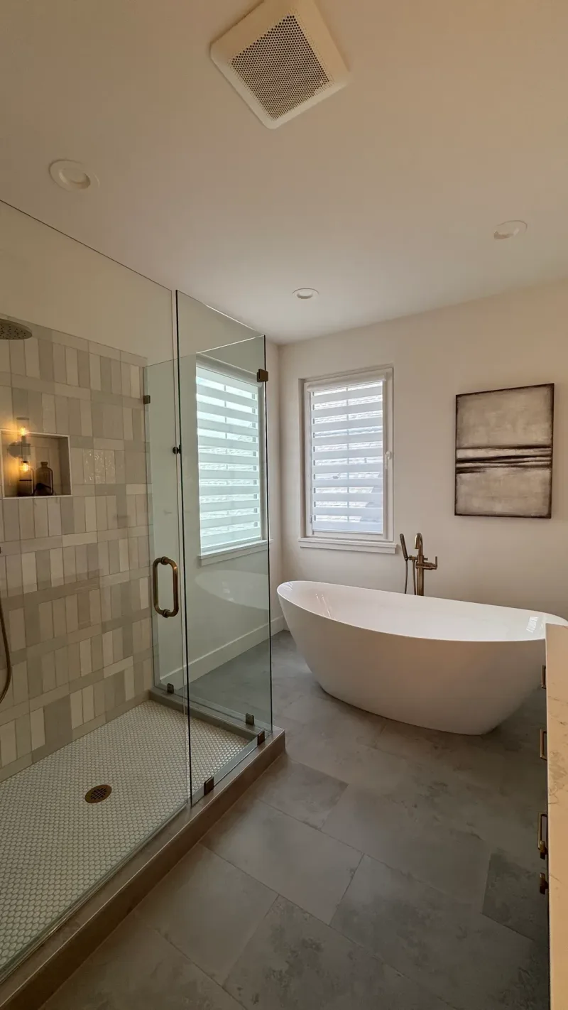 Bathroom with a glass shower and a freestanding tub