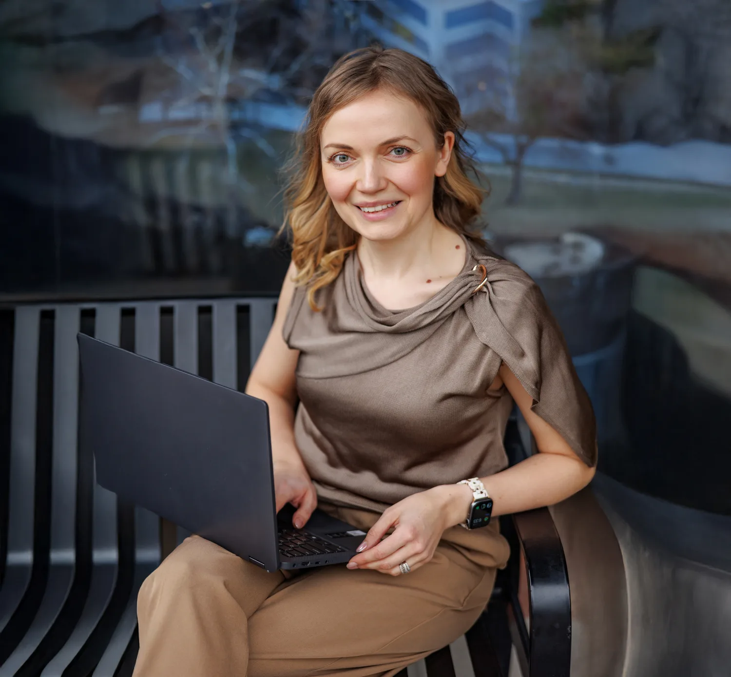 Tatyana with her laptop, ready to walk you through Canva