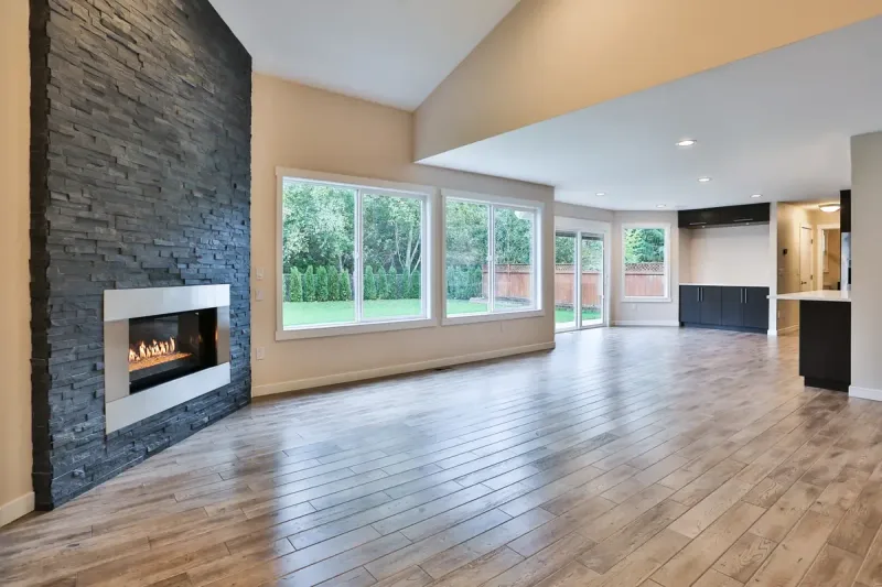 A stacked-stone fireplace wall in a vaulted room